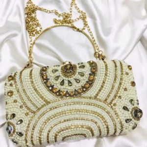 White and gold beaded clutch with gold handle by Mohikas